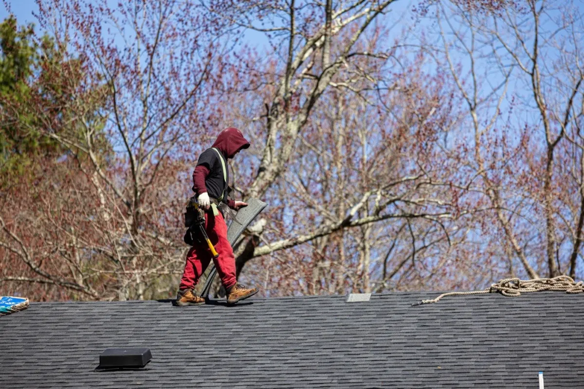 Senco crew installing a new replacement window on a home in Andover, MA