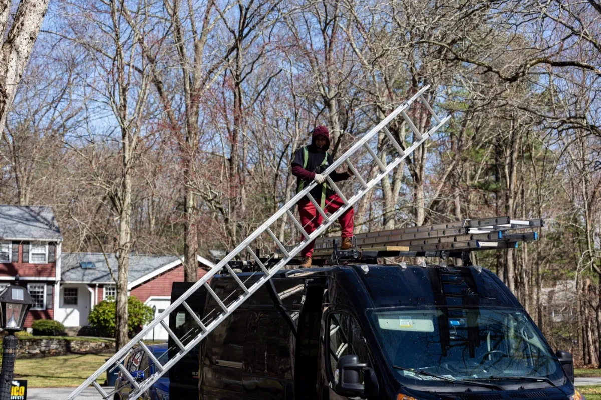 Seamless aluminum gutter installation on a home in Billerica, MA