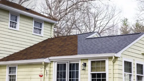 Senco's Roof Color Designer with half of a real roof re-colored in CertainTeed Burnt Sienna beside the home's original grey shingles